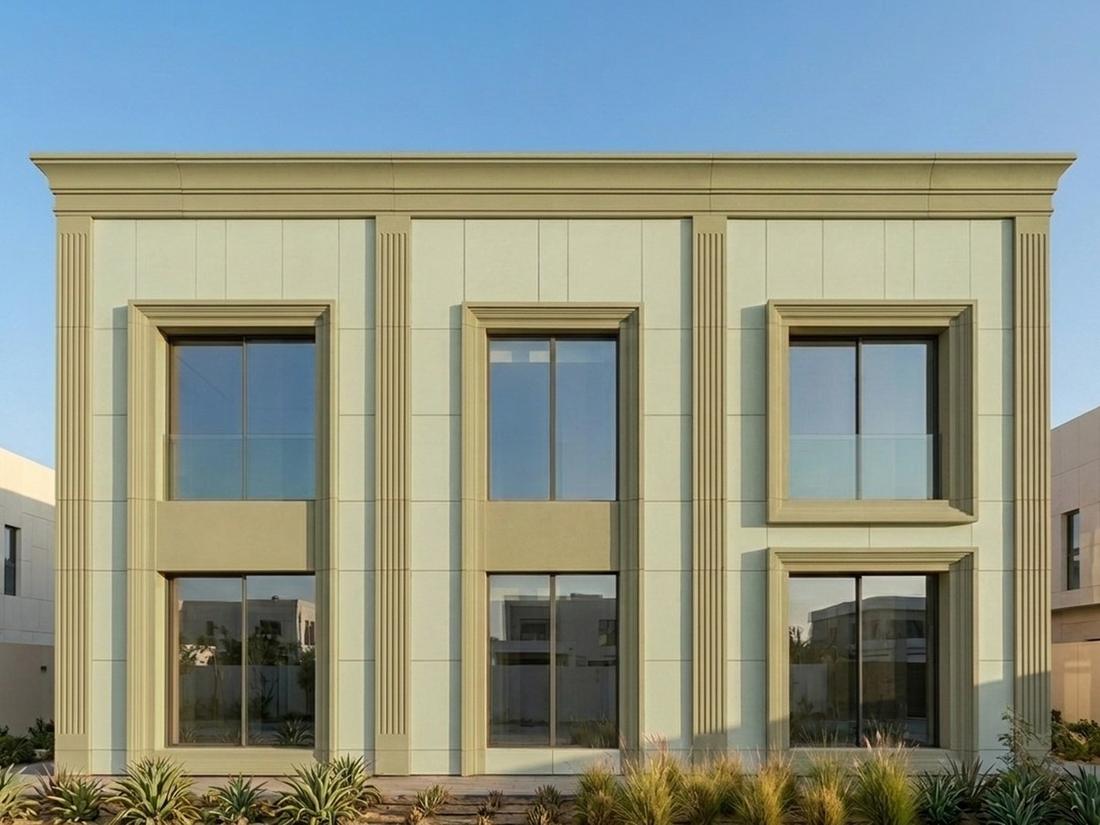 Sage-green facade with CLADECO® cornice, pilasters and window surrounds