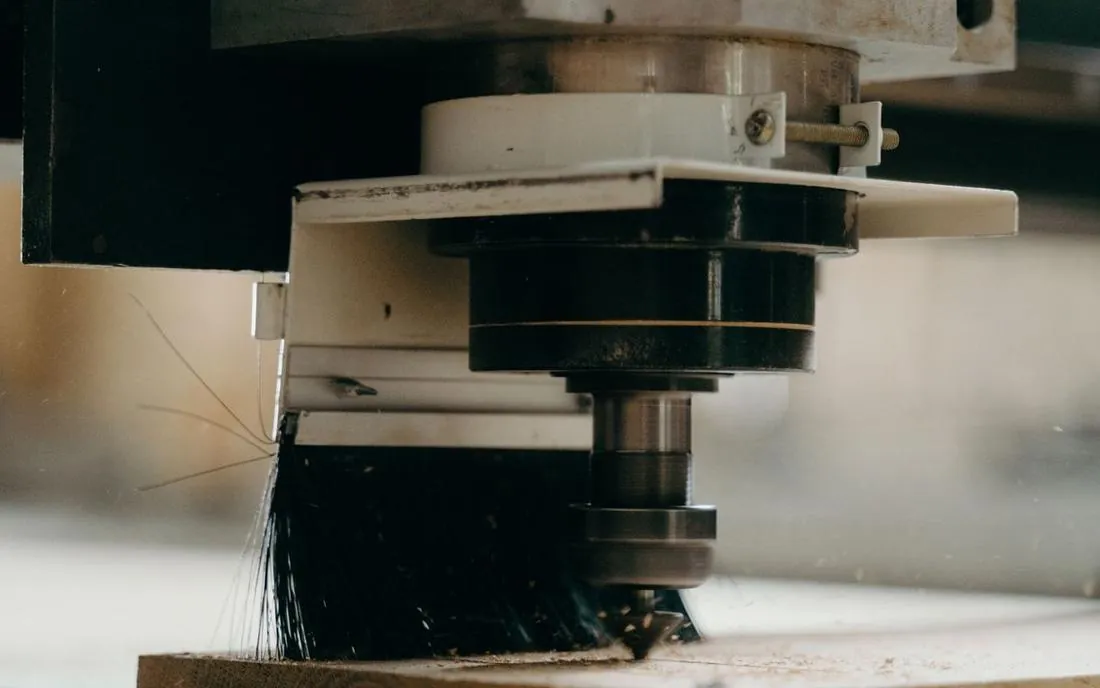 A CNC router cutting a profile directly — no mold tooling required